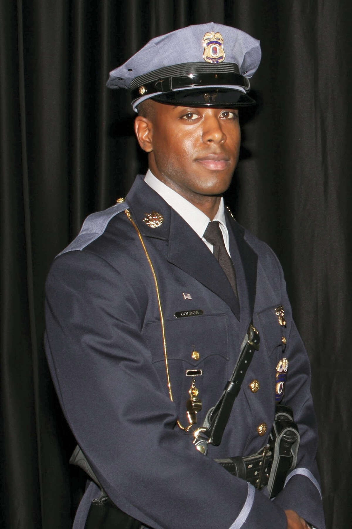 This undated photo provided by the Prince George’s County Police Department shows officer Jacai Colson, a 4-year veteran of the Maryland county’s police force. A gunman fired outside a Maryland police station on Sunday, March 13, 2016, prompting a gun battle that killed Colson and wounded the suspect, authorities said.
