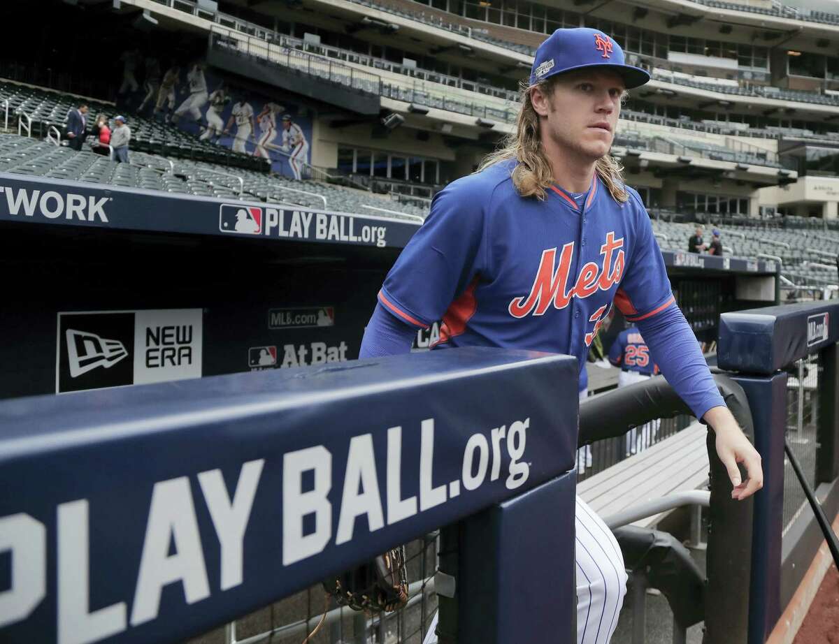New York Mets starting pitcher Noah Syndergaard steps onto the field for a team workout Tuesday at Citi Field.