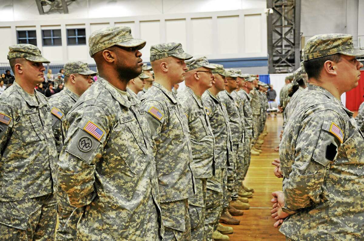 Soldiers of the 143rd Regional Support Group and the 192nd Military Police Battalion appear at a send-off ceremony on March 5 in Hartford.