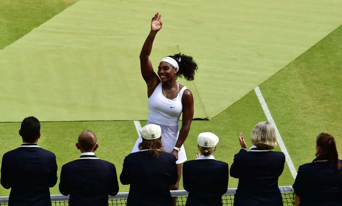 Serena Williams waves to the crowd after beating Garbine Muguruza on Saturday at the All England Lawn Tennis Championships in Wimbledon, London.