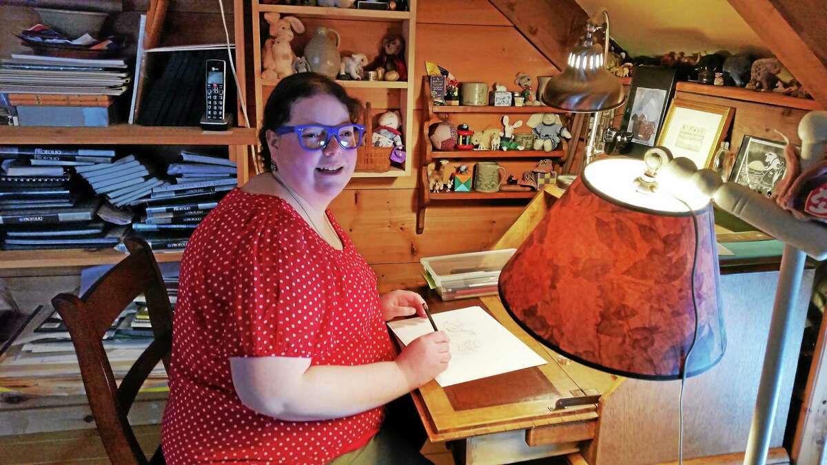 Elizabeth Wolff gets creative in her bedroom studio at an antique secretary desk her mother restored.