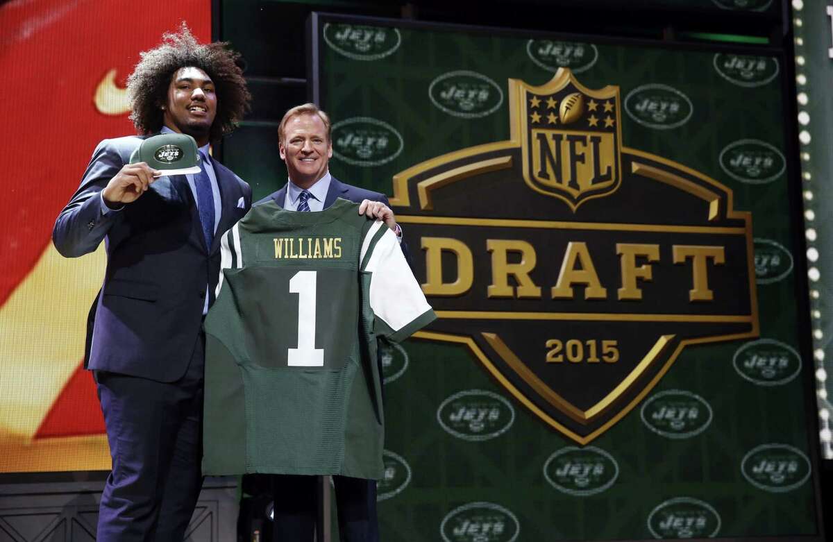 USC defensive lineman Leonard Williams poses for photos with NFL commissioner Roger Goodell after being selected by the New York Jets with the sixth pick on Thursday.