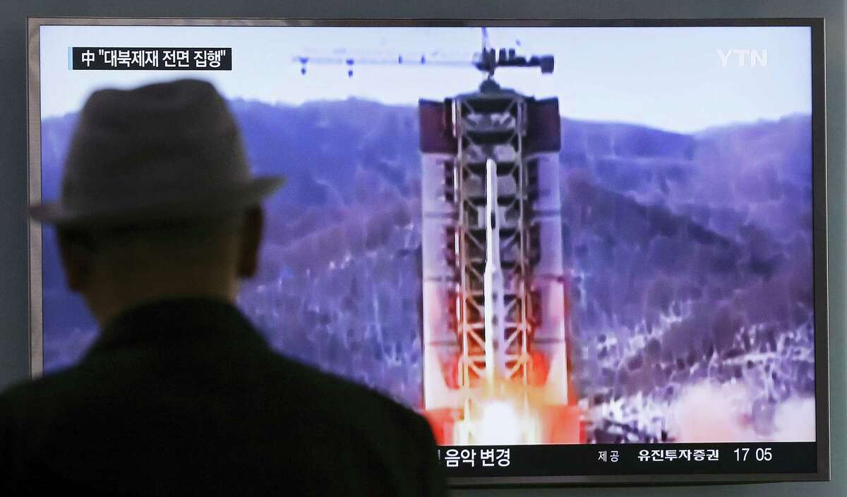 A man watches a TV news program showing a file footage of North Korea’s rocket launch at Seoul Railway Station in Seoul, South Korea on April 28, 2016. A suspected powerful intermediate-range North Korean missile crashed moments after liftoff Thursday,