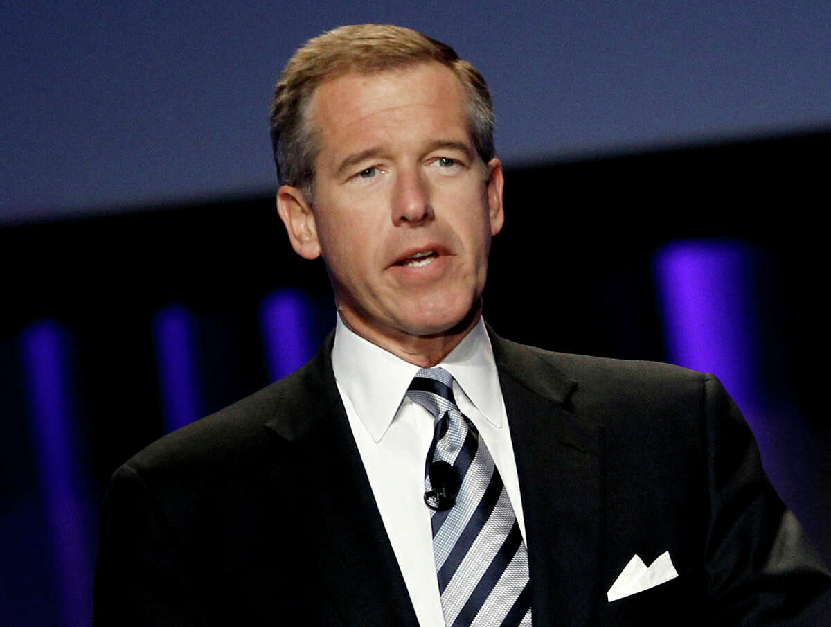 In this Oct. 26, 2010 file photo, Brian Williams, then anchor and managing editor of “NBC Nightly News,” speaks at the Women’s Conference in Long Beach, Calif. A threat of violence against Los Angeles schools brought Williams back on-air for NBC News. In his first appearance since losing his anchor job, Williams handled a NBC News special report Tuesday, Dec. 15, 2015, on the closure of LA public schools.