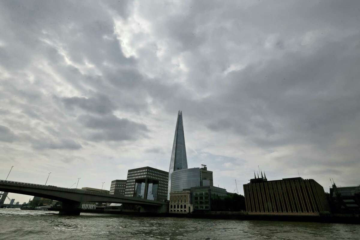 In this Thursday, June 19, 2014, file photo, the Shard as seen from the river Thames in London. A new report says a drone just missed hitting an A320 passenger plane flying above the Shard skyscraper in central London in July. The “very near-miss” underscored the fears of many aviation experts about the growing popularity of drones. The plane was approaching Heathrow Airport and flying at nearly 5,000 feet (1,525 meters) when the pilot spotted a 50-centimeter (20-inch) drone off the right flight deck window, it was reported on Thursday, Nov. 17, 2016.