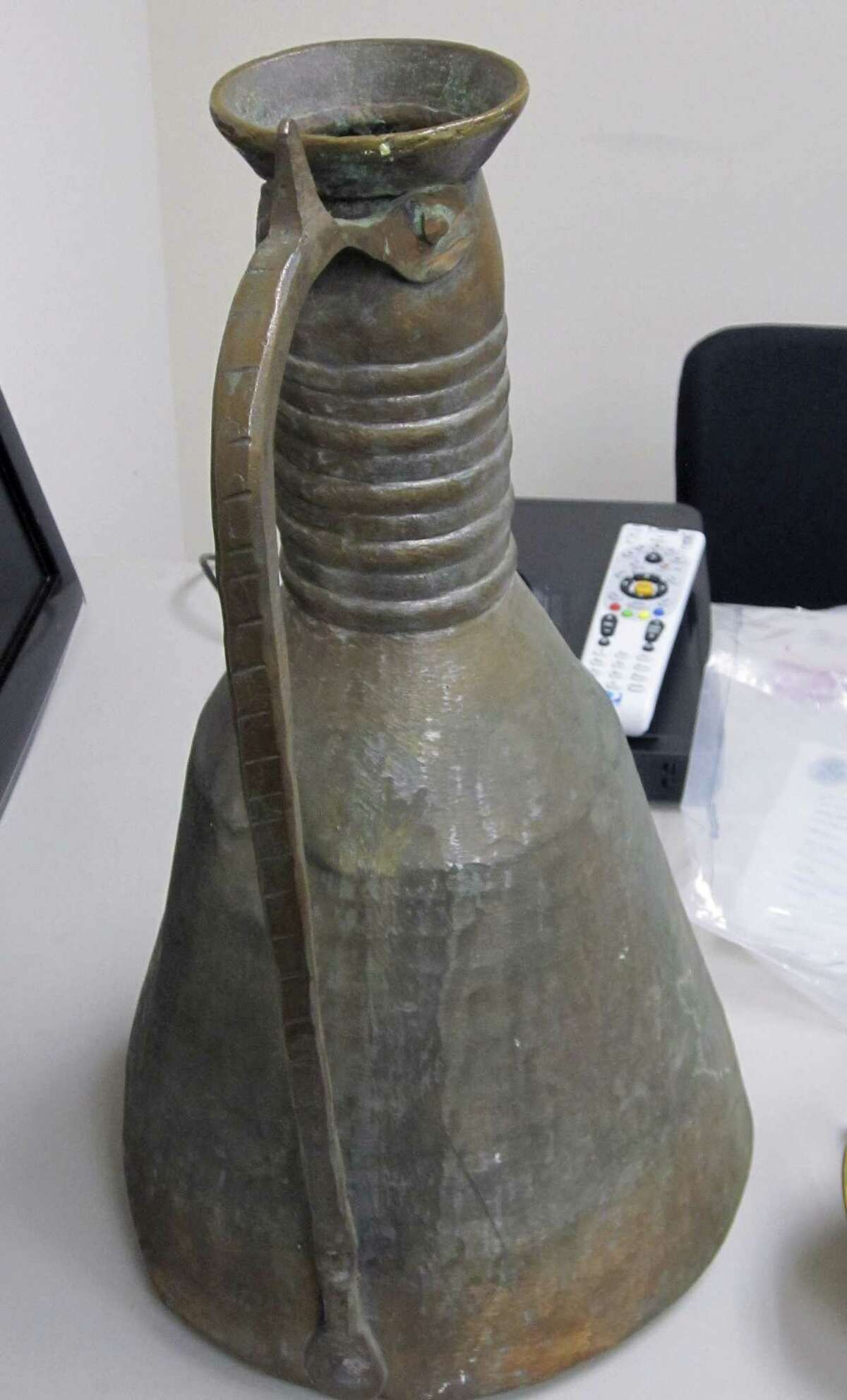 FILE - This undated file photo released by U.S. Immigration and Customs Enforcement shows a water urn, one of many items looted from Saddam Husseinís palaces, that were recovered by federal investigators and formally repatriated to Iraq in a March 16, 2015, ceremony at the Iraqi consulate in Washington. Officials traced the urn to an American defense contractor who worked in Iraq and who acknowledged taking it. Laws prohibit the export and sale of antiquities that belong to foreign governments. The case was presented to federal prosecutors in Connecticut but they declined to file charges. (AP Photo/U.S. Immigration and Customs Enforcement, File)