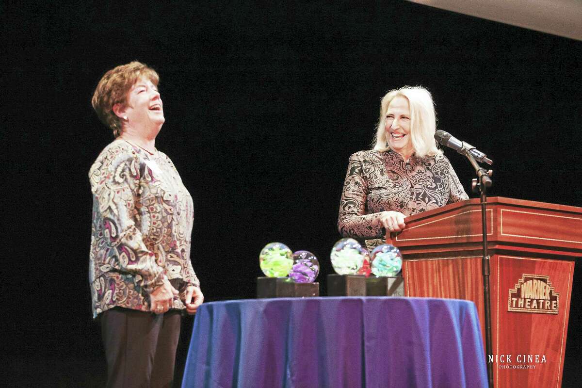 Nick Cinea PhotographyArtist Diane Dubriel receives an award from state Rep. Roberta Willis (D-64th) during the CultureMAX awards Tuesday night at the Warner Theatre.