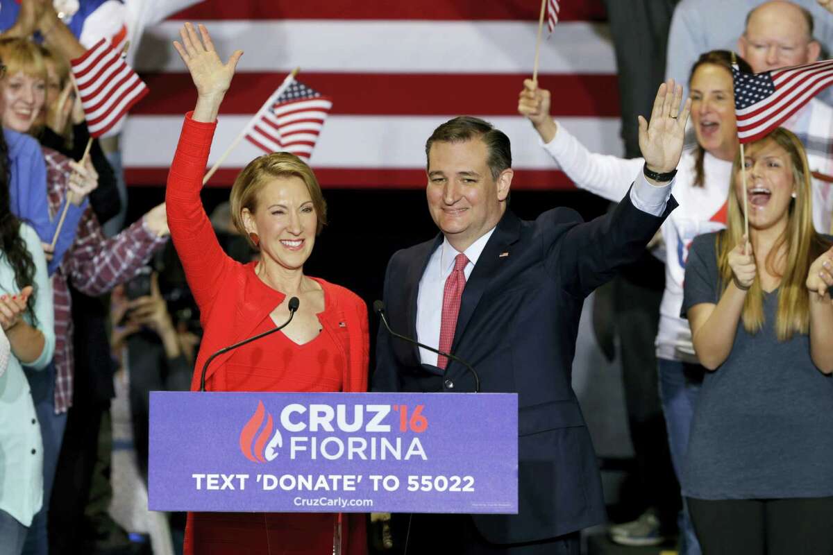 Republican presidential candidate Sen. Ted Cruz, R-Texas, joined by former Hewlett-Packard CEO Carly Fiorina waves during a rally in Indianapolis, Wednesday, April 27, 2016, when Cruz announced he has tapped Fiorina to serve as his running mate.