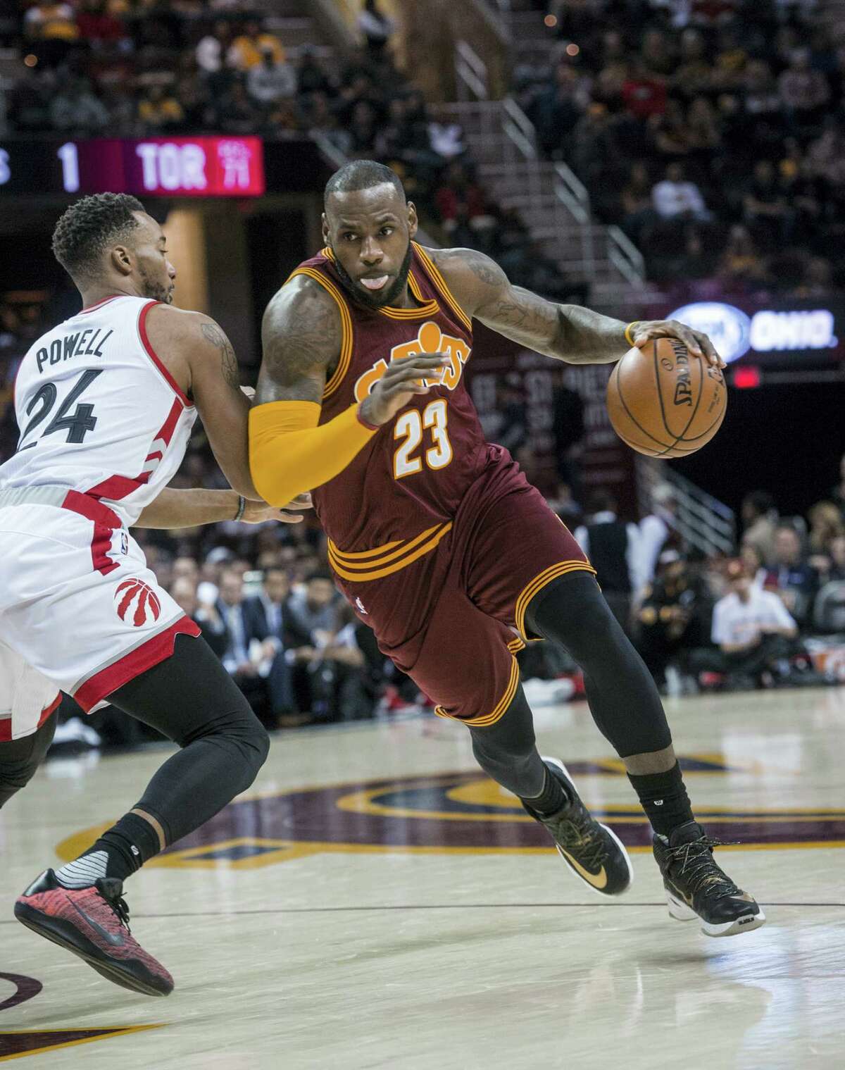 Cleveland Cavaliers’ LeBron James (23) drives past Toronto Raptors’ Norman Powell (24) during the first half of an NBA basketball game in Cleveland Tuesday, Nov. 15, 2016.