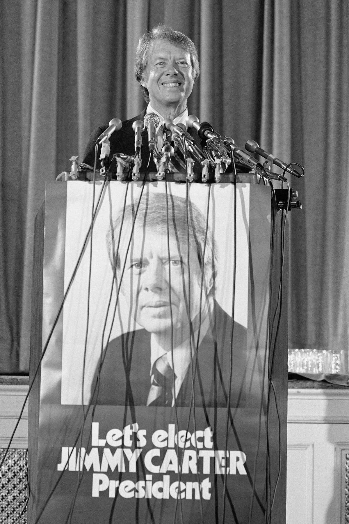 In this Aug. 14, 1975 photo, former Georgia Gov. Jimmy Carter announces in Washington that he qualified for federal matching funds to help finance his campaign for the 1976 Democratic presidential nomination.