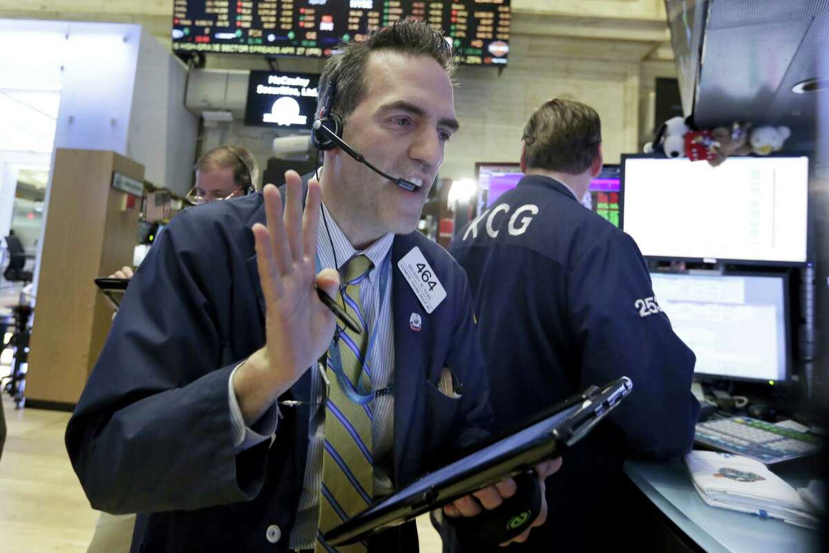 Trader Gregory Rowe works on the floor of the New York Stock Exchange Wednesday.