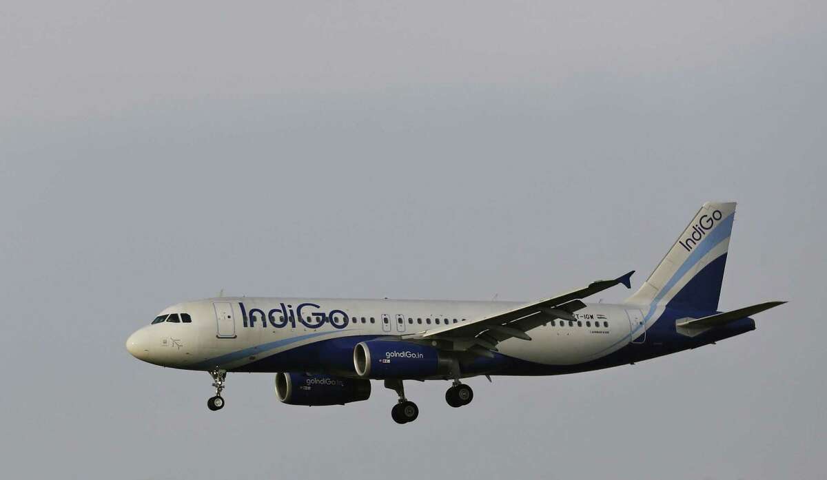 FILE- This April 16, 2015 file photo shows an India's budget airline IndiGo aircraft approaching for landing at the Indira Gandhi International (IGI) airport in New Delhi, India. Indian budget airline IndiGo finalized an exceptionally large order for 250 single-aisle Airbus A320neo jets on Monday, Aug. 17, 2015 to keep up with rapid growth in the country's air travel.