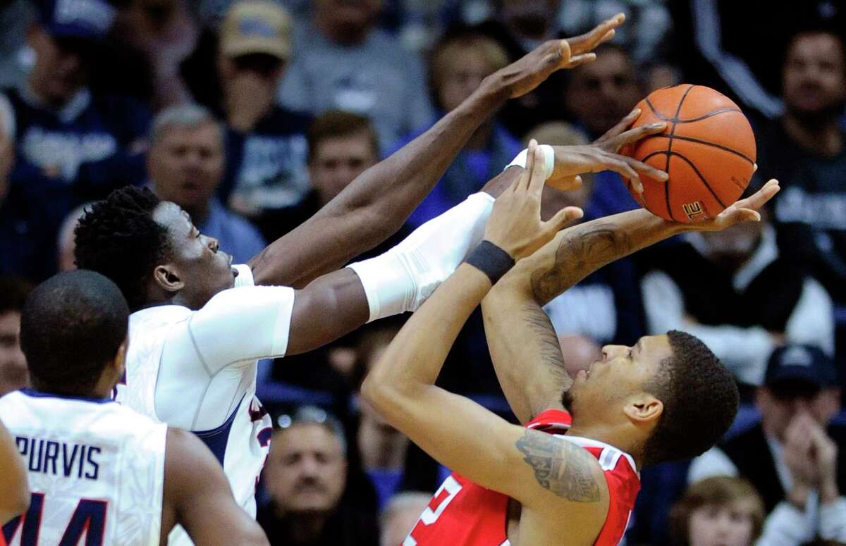 Ohio State’s Marc Loving’s shot is blocked by UConn’s Amida Brimah during the first half on Saturday.