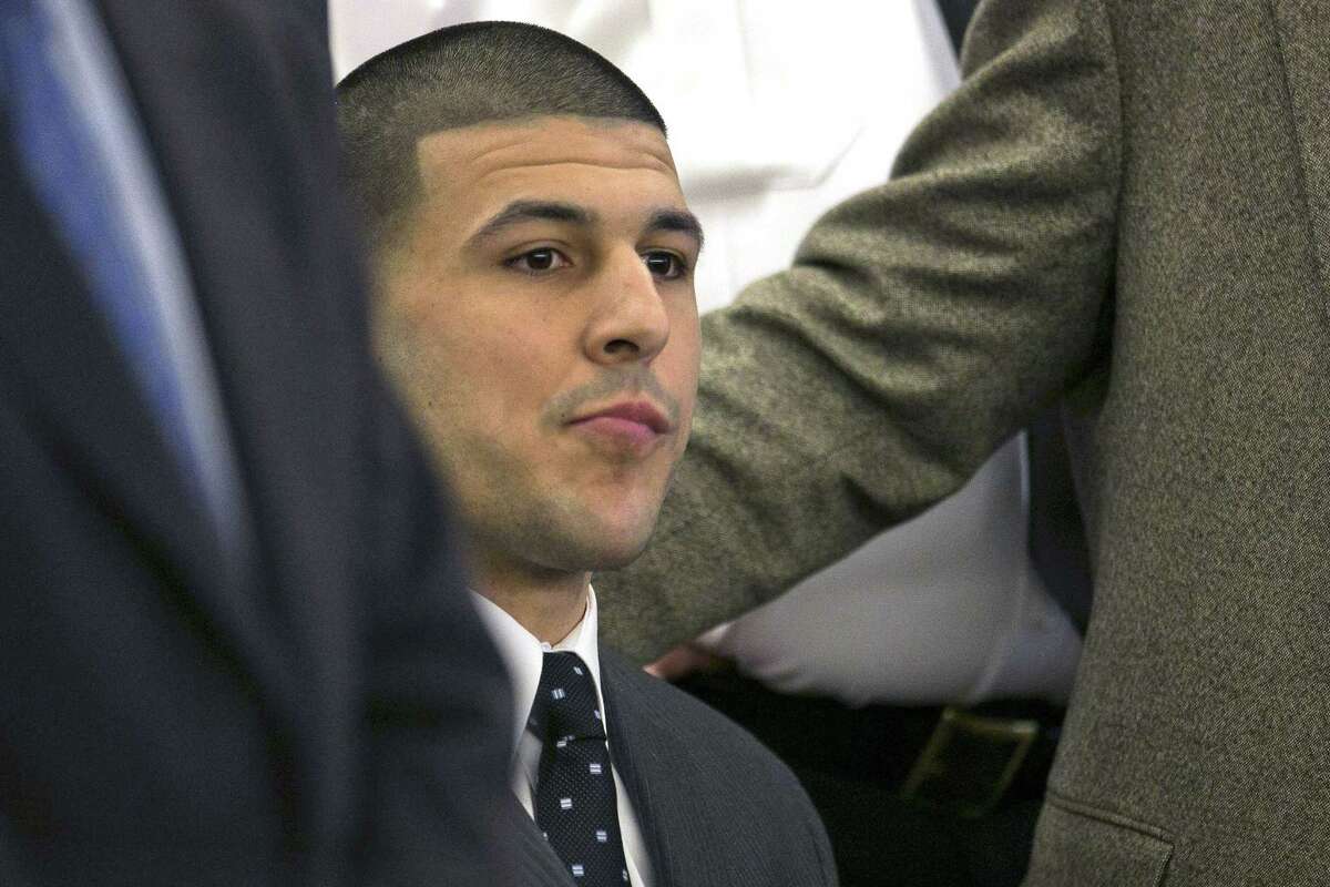 Aaron Hernandez listens as the guilty verdict is read on April 15 during his murder trial at the Bristol County Superior Court in Fall River, Mass.