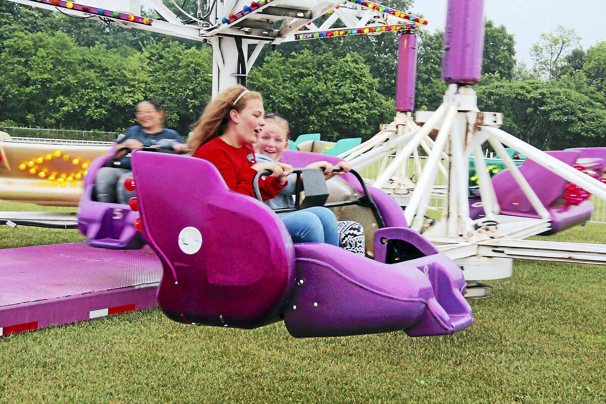 Participants enjoy the rides at Torrington’s Independence Day Celebration and Fireworks Show at Torrington Middle School on Saturday.