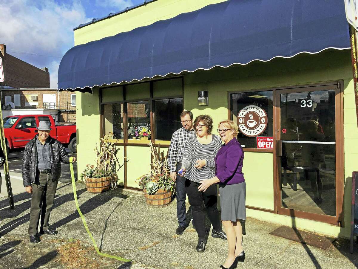 Ben Lambert - The Register Citizen The Good Company Coffee House, located on Franklin Street in Torrington, officially opened for business Wednesday. Above, owner Michelle Wall, center, and Mayor Elinor Carbone, right, cut the ribbon during the grand opening.