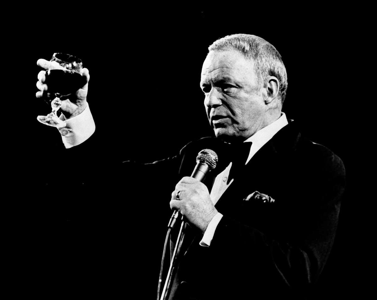 In this Oct. 13, 1976 file photo singer Frank Sinatra performs at the Providence Civic Center in Rhode Island to a capacity crowd. Sinatra, who died in 1998, at 82, would have celebrated his 100th birthday on Dec. 12, 2015. (AP Photo)