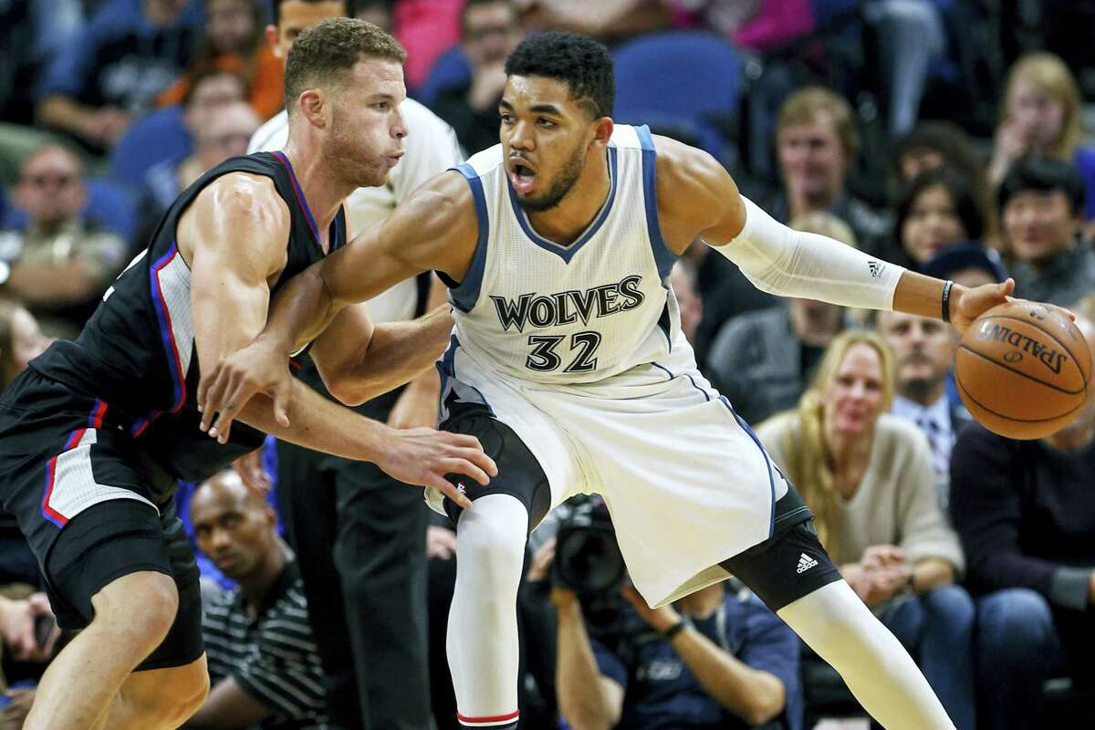 Los Angeles Clippers forward Blake Griffin (32) defends Minnesota Timberwolves center Karl-Anthony Towns (32) in the second half of an NBA basketball game on Nov. 12, 2016 in Minneapolis. The Clippers won 119-105.