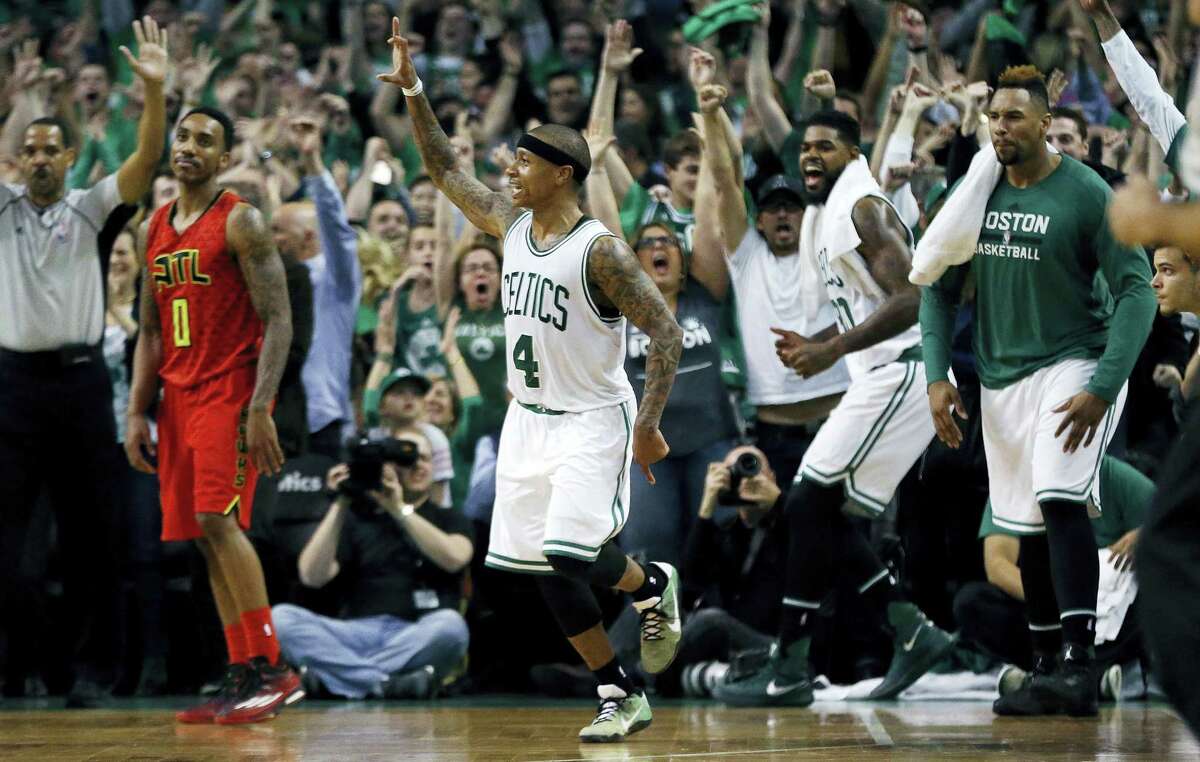 The Celtics’ Isaiah Thomas (4) celebrates after hitting a 3-pointer during the fourth quarter against the Hawks on Sunday.