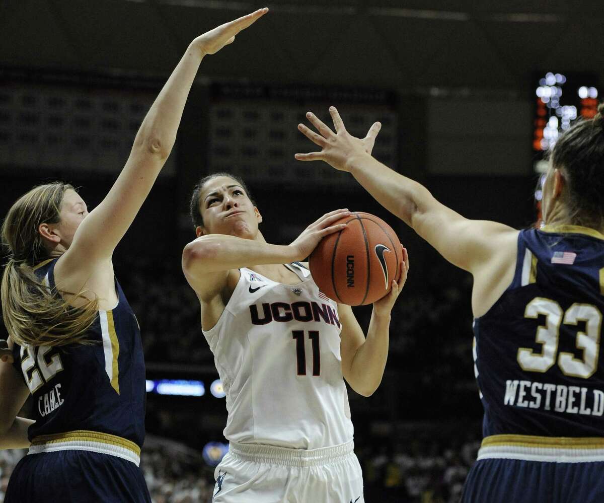 UConn’s Kia Nurse shoots between Notre Dame’s Madison Cable, left, and Kathryn Westbeld during the Huskies’ win on Sunday.