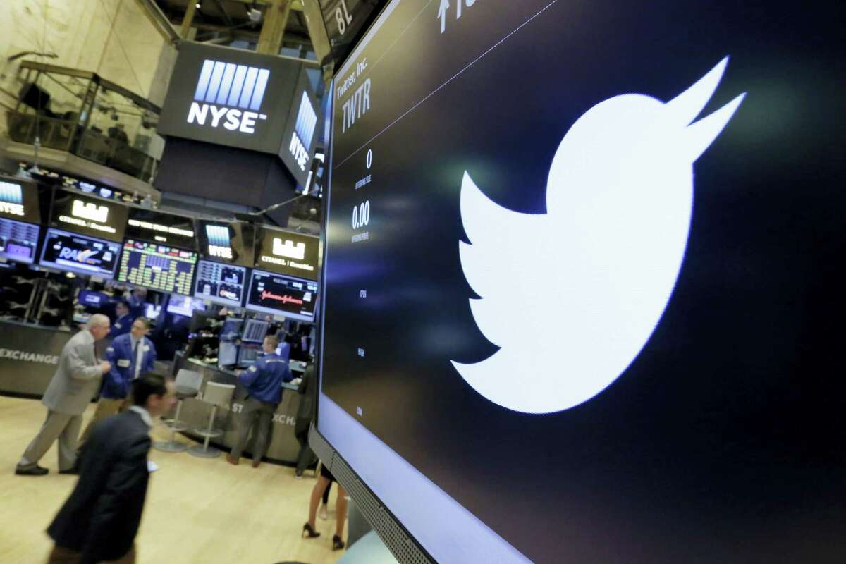 The Twitter symbol appears above a trading post on the floor of the New York Stock Exchange. Twitter, long criticized as a hotbed for online harassment, is expanding ways to curb the amount of abuse users see and making it easier to report such conduct.
