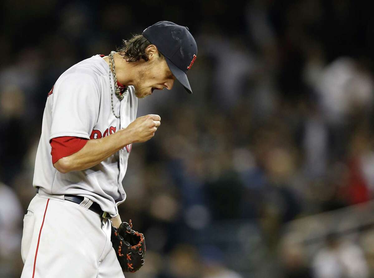 Red Sox starting pitcher Clay Buchholz reacts during the first inning of Sunday’s game against the Yankees.
