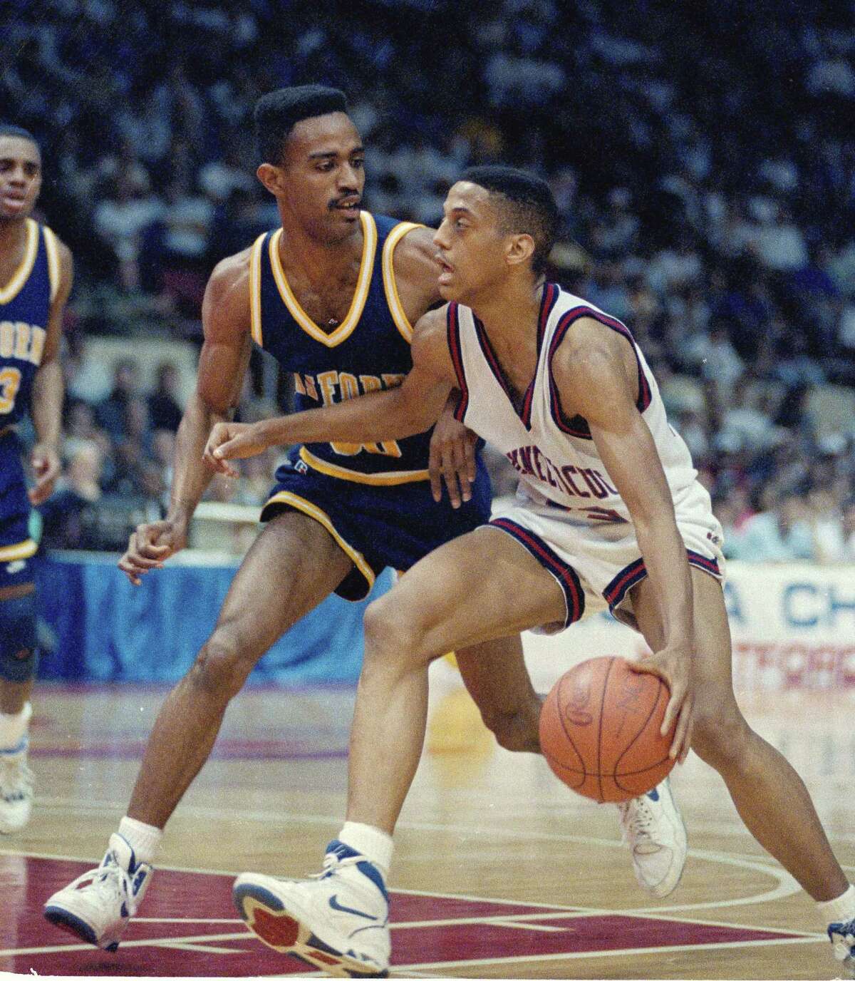 Tate George (right) during the 1990 NCAA tournament.