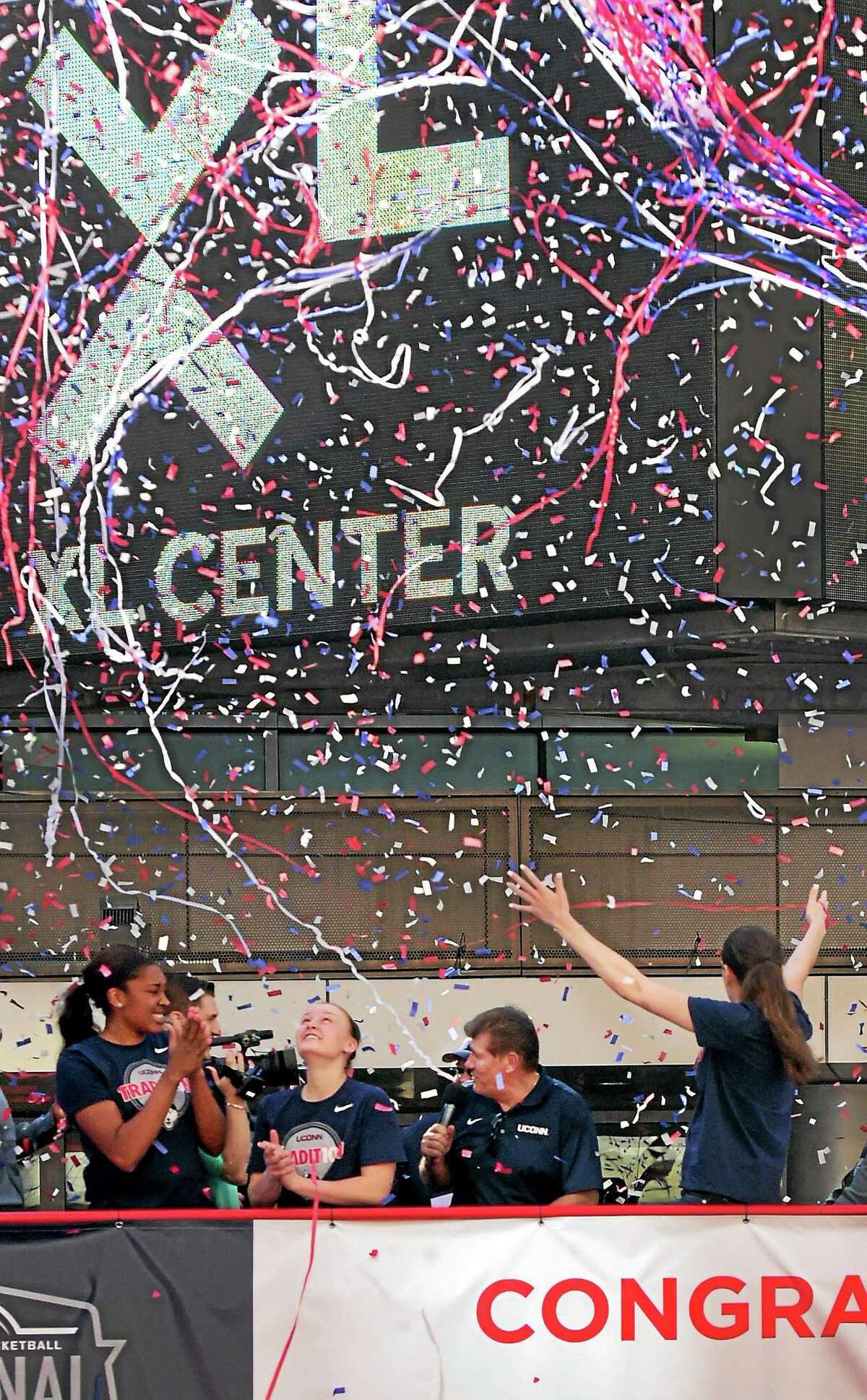 (Peter Hvizdak - New Haven Register) Confetti falls on the 2015 NCAA National Champion University of Connecticut Women's Basketball team as it is honored during a rally after a victory parade sponsored by the State of Connecticut, the City of Hartford, and the Hartford Business Improvement District Sunday afternoon congratulating them for their efforts.