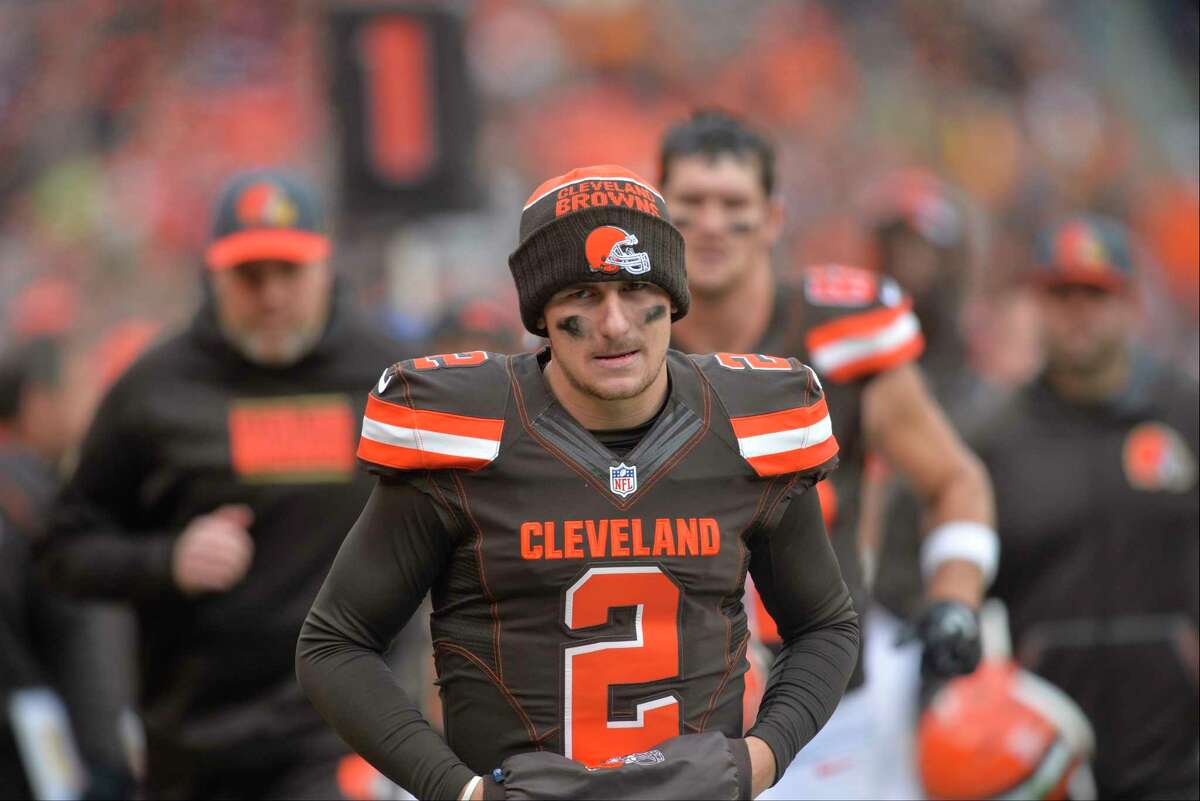 Browns quarterback Johnny Manziel walks off the field Sunday in Cleveland.