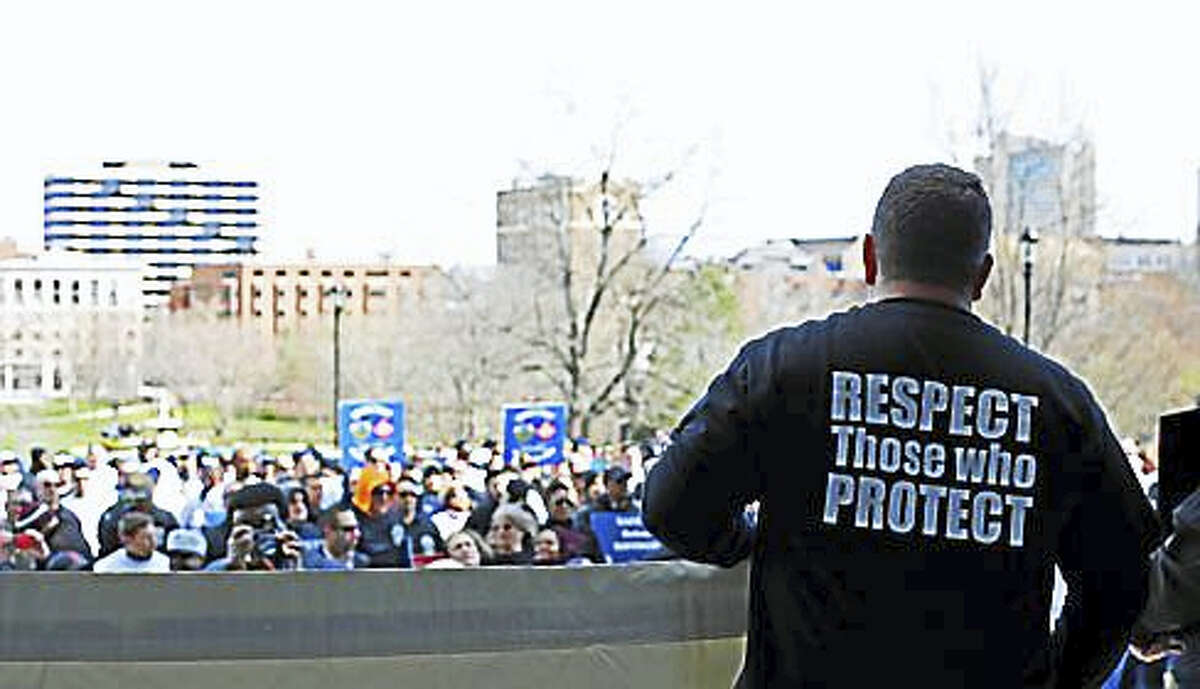 Public safety workers rally at the state Capitol at the end of March.