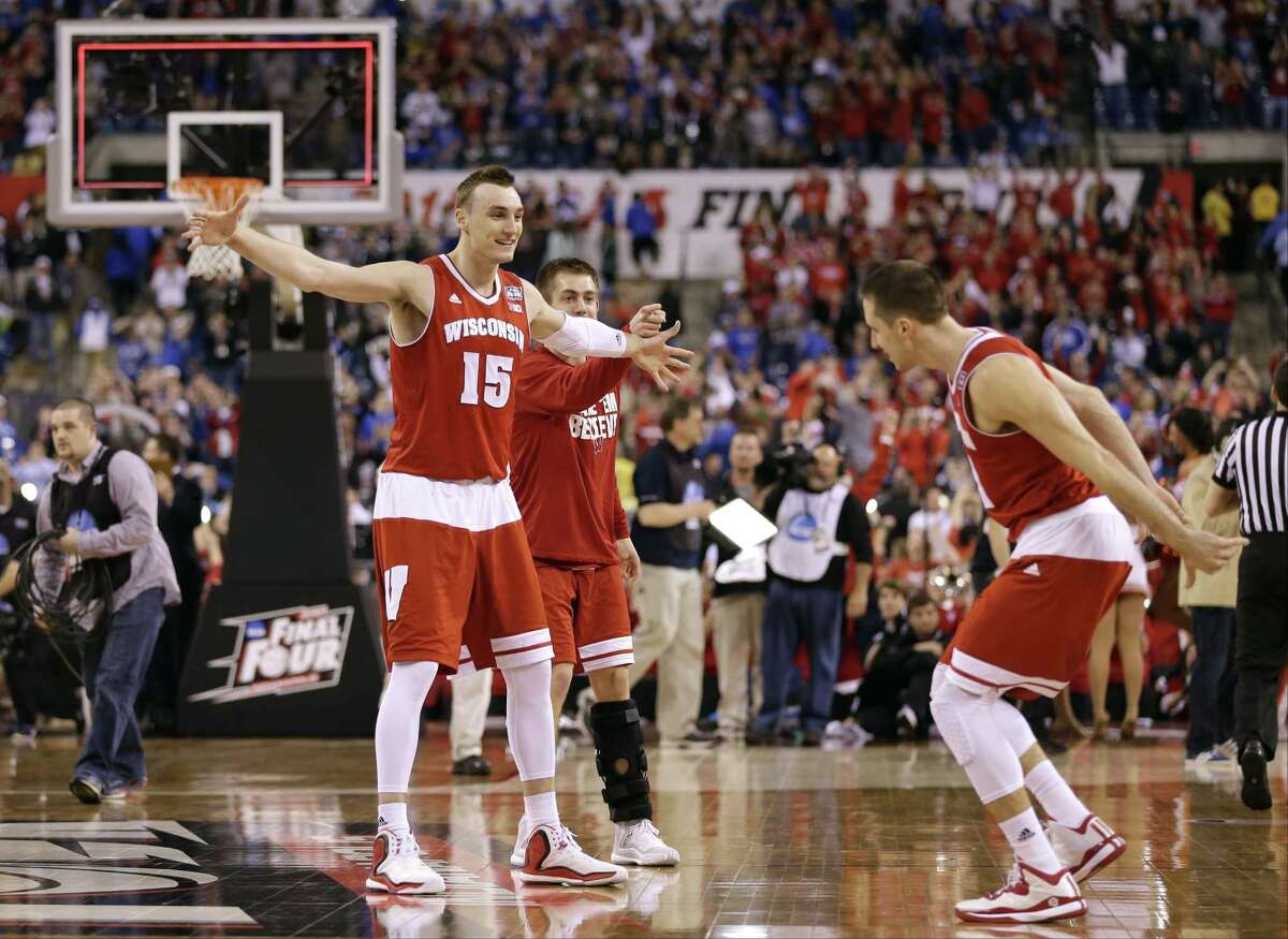 Wisconsin’s Sam Dekker, left, celebrates with teammate Josh Gasser after a Final Four win over Kentucky in Indianapolis.