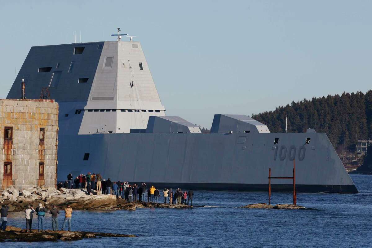 The first Zumwalt-class destroyer, USS Zumwalt, the largest ever built for the U.S. Navy, passes spectators at Fort Popham at the mouth of the Kennebec River in Phibbsburg, Maine on Dec. 7, 2015.