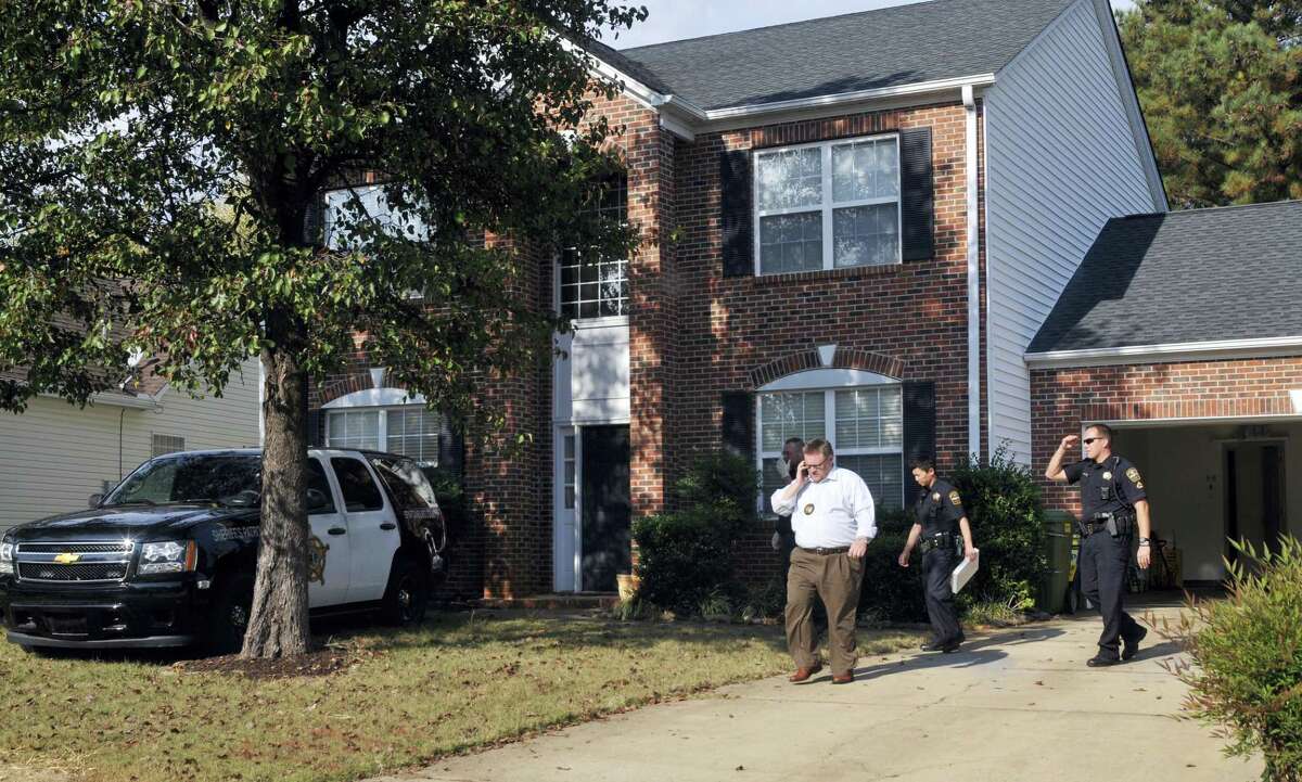 In this Thursday, Nov. 3, 2016, file photo, registered sex offender Todd Christopher Kohlhepp’s home is searched by Spartanburg County Sheriff’s deputies and his vehicles are impounded in Moore, S.C., after he was arrested earlier in the day. Kohlhepp, accused of seven killings in South Carolina, built a successful real-estate firm but displayed odd behavior. People who knew or worked with him said he watched pornographic videos during work and openly discussed that he was a registered sex offender.