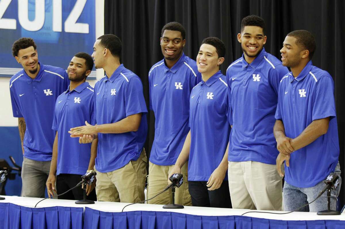 From left, Kentucky players Willie Cauley-Stein, Andrew Harrison, Trey Lyles, Dakari Johnson, Devon Booker, Karl-Anthony Towns and Aaron Harrison stand during a news conference where they announced their intent to enter the NBA Draft on Thursday in Lexington, Ky.