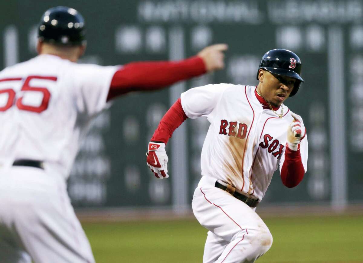 Mookie Betts rounds third during Wednesday’s game in Boston.
