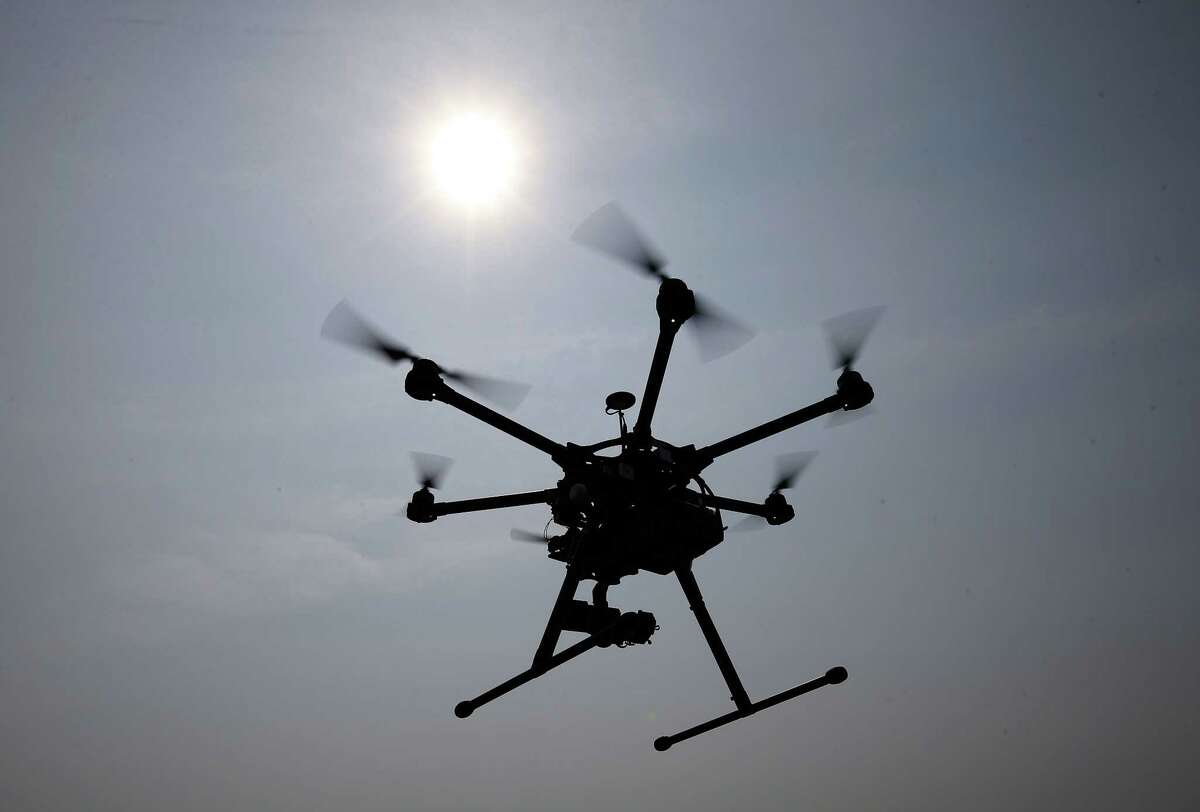 In this June 11, 2015, file photo, a hexacopter drone is flown in Cordova, Md. Pilot reports of drone sightings so far this year are more than double last year, the Federal Aviation Administration reported Thursday. There have been more than 650 reports this year by pilots of unmanned aircraft flying near manned aircraft, according to the FAA. There were 238 drone sightings in all of 2014.