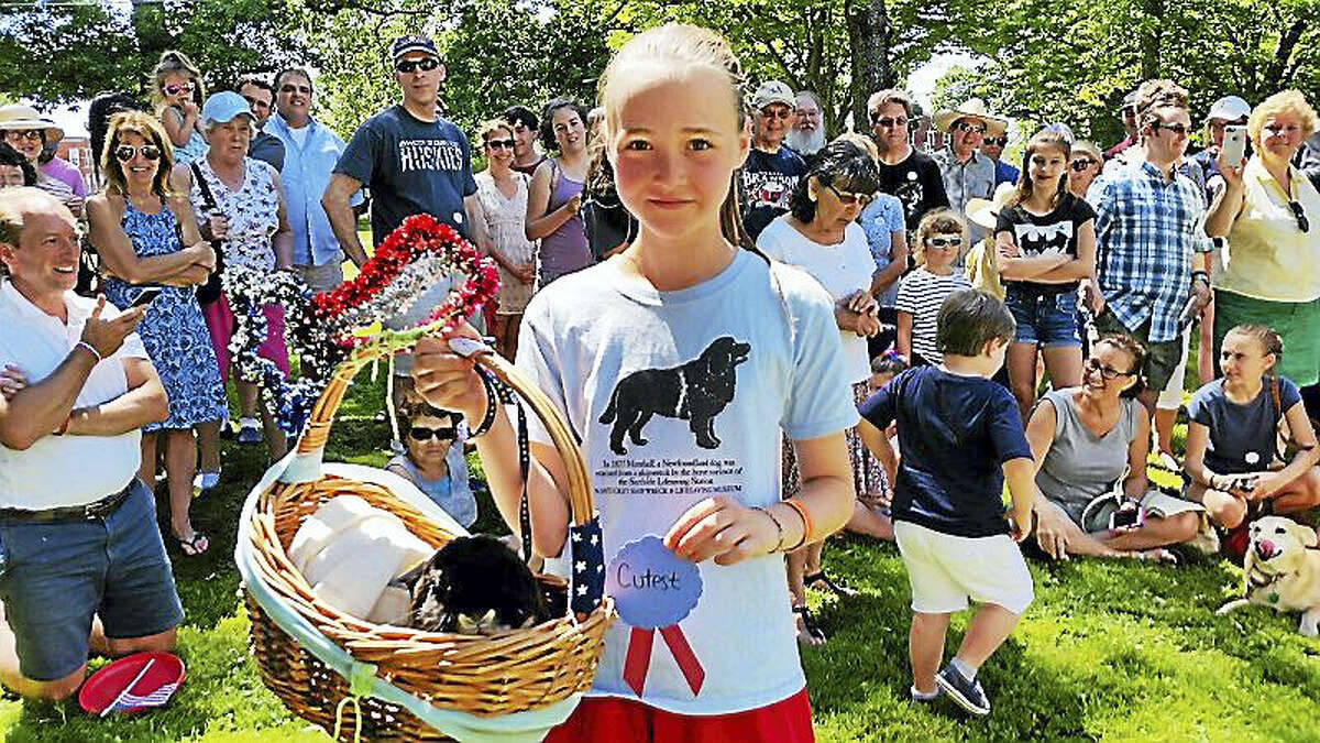 Blackberry, a four-year-old Hollandale rabbit belonging to Kaiya Winter of Litchfield, won the “Cutest” ribbon at the 17th annual Litchfield Historical Society’s Pet Parade and Turn-of-the-Century Fest at the Litchfield Town Green on Monday afternoon. The 50 mostly-canine contestants won ribbons while their owners and children had ice cream and played old-fashioned lawn games.
