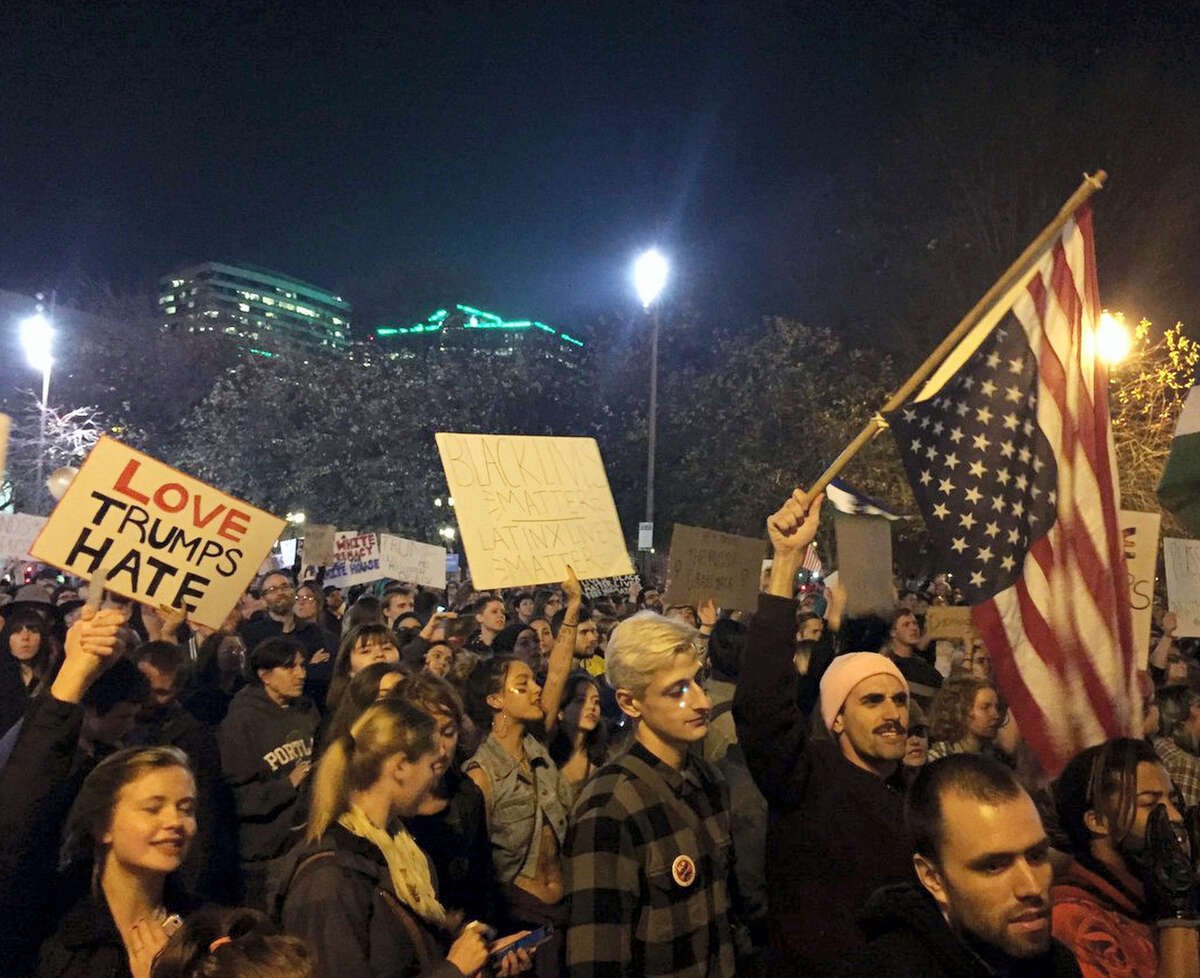 Protesters march on their way to Waterfront Park in Portland, Ore., on the third day of protests over the results of the 2016 U.S. presidential election, Thursday, Nov. 10, 2016. President-elect Donald Trump fired back on social media after demonstrators in both red and blue states hit the streets for another round of protests, showing outrage over the Republican’s unexpected win.