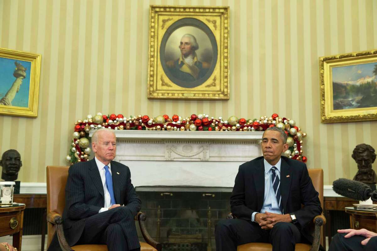 President Barack Obama, accompanied by Vice President Joe Biden, pauses while making a statement on Wednesday’s mass shooting in San Bernandino, Calif. on Dec. 3, 2015, in the Oval Office of the White House in Washington.