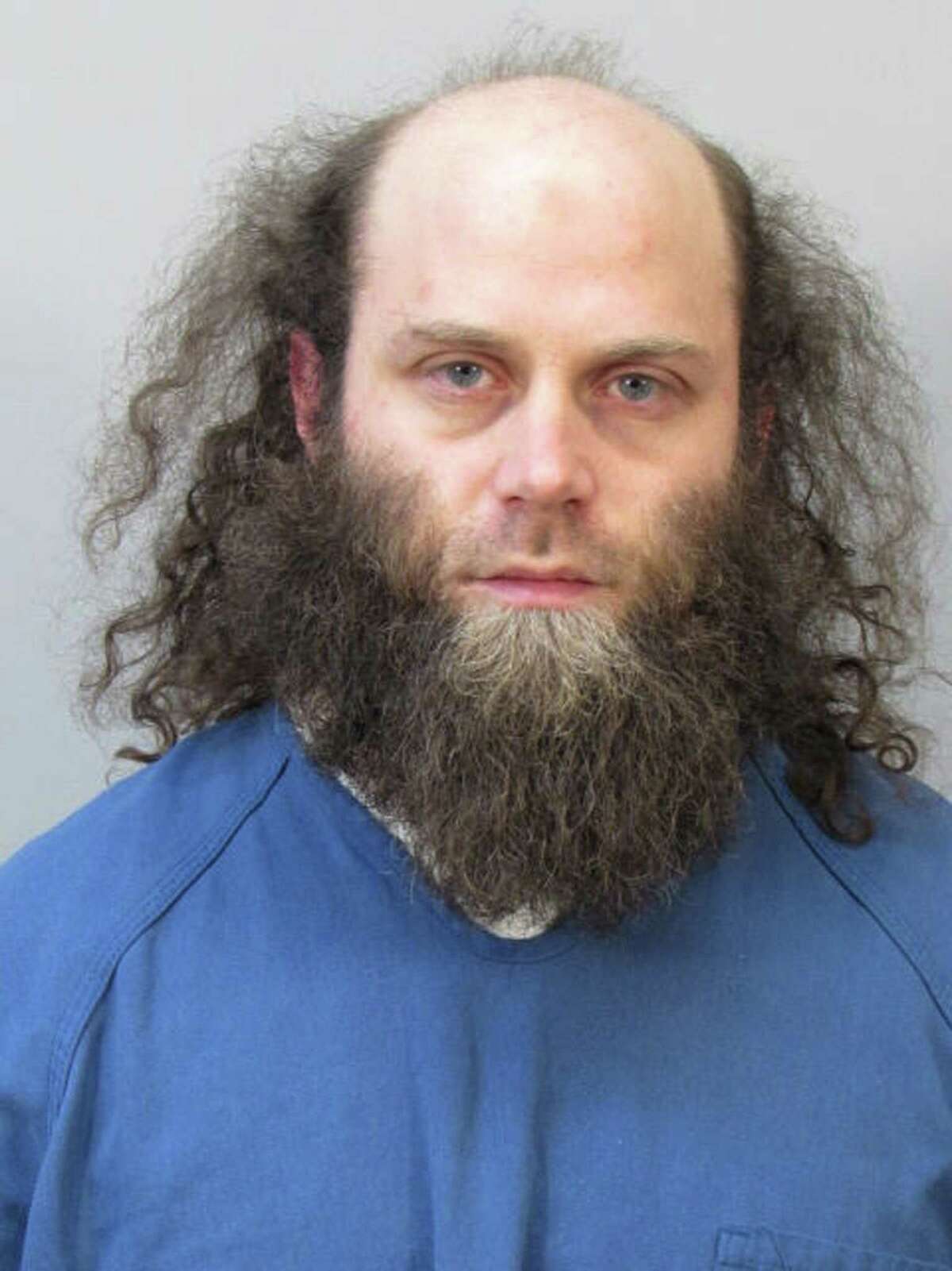 In this photo provided by the Dane County Sheriff’s Office, Joshua Van Haften, 34, appears as he is booked Wednesday, April 8, 2015, in Madison, Wisc. Van Haften, accused of traveling to Turkey as part of a failed attempt to join the Islamic State in Syria, was ordered held without bond Thursday for trying to aid a terrorist group.