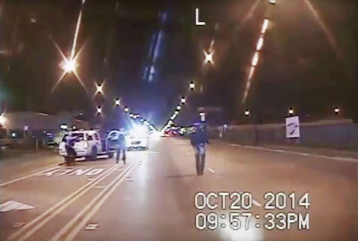 In this Oct. 20, 2014 frame from dash-cam video provided by the Chicago Police Department, Laquan McDonald, right, walks down the street moments before being shot by officer Jason Van Dyke in Chicago. Amid an outcry after the city waited more than a year to release dash-cam footage of Officer Van Dyke shooting McDonald 16 times, Mayor Rahm Emanuel announced this week that he was setting up a special task force to examine, among other things, the city’s video-release policy.