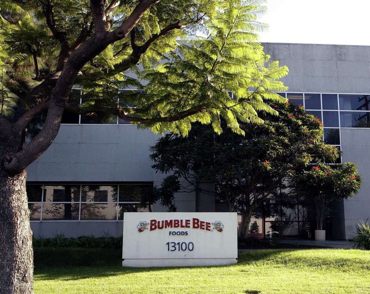 This Monday, Oct. 15, 2012, file photo shows the Bumble Bee tuna processing plant in Santa Fe Springs, Calif. Bumble Bee Foods has agreed to pay $6 million Wednesday, Aug. 12, 2015, to settle criminal charges in the death of a Los Angeles-area worker who was cooked in an oven with tons of tuna.