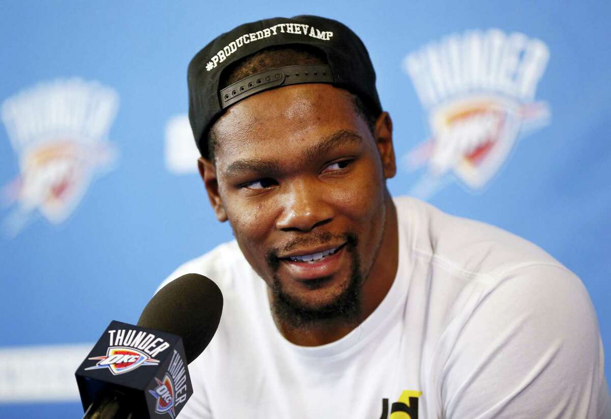 In a Wednesday, June 1, 2016 file photo, Oklahoma City’s Kevin Durant (35) speaks during a news conference at the team’s practice facility in Oklahoma City. Durant announced Monday, July 4, 2016 that he is joining All-Stars Stephen Curry and Klay Thompson with the Golden State Warriors. Durant made the decision public on The Players’Äô Tribune Monday morning. He can’Äôt officially sign until July 7.