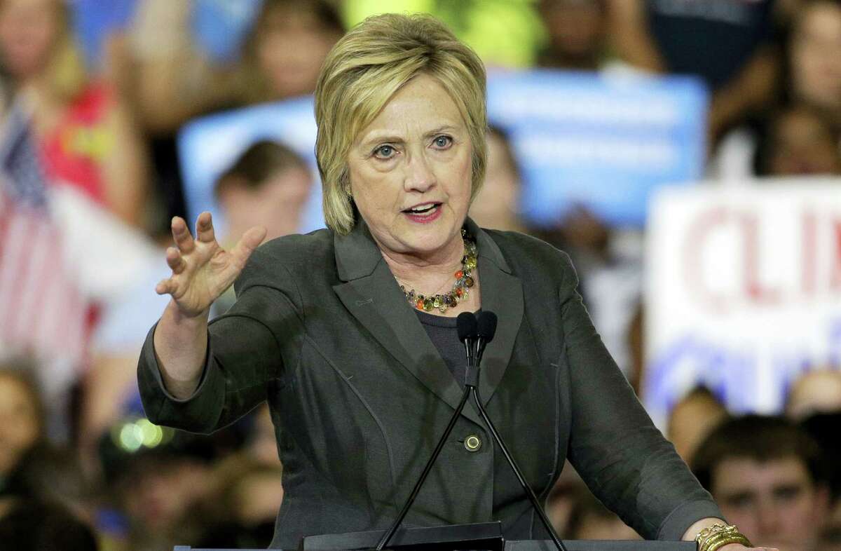 In this June 22, 2016 photo, Democratic presidential candidate Hillary Clinton gestures as she speaks during a rally in Raleigh, N.C.