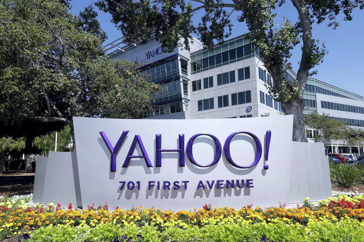 In this file photo, flowers bloom in front of a Yahoo sign at the company’s headquarters in Sunnyvale.