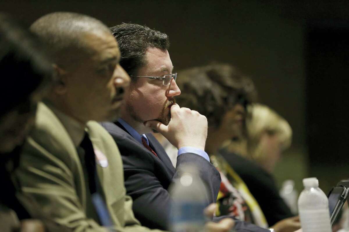 In this March 15, 2016 file photo, Ferguson Mayor James Knowles III listens during a city council meeting in Ferguson, Mo. St. Louis-area residents were sounding off Tuesday, April 19, 2016 in the last public hearing on the U.S. Department of Justice’s settlement that calls for sweeping changes in Ferguson, where 18-year-old Michael Brown was fatally shot by a police officer.
