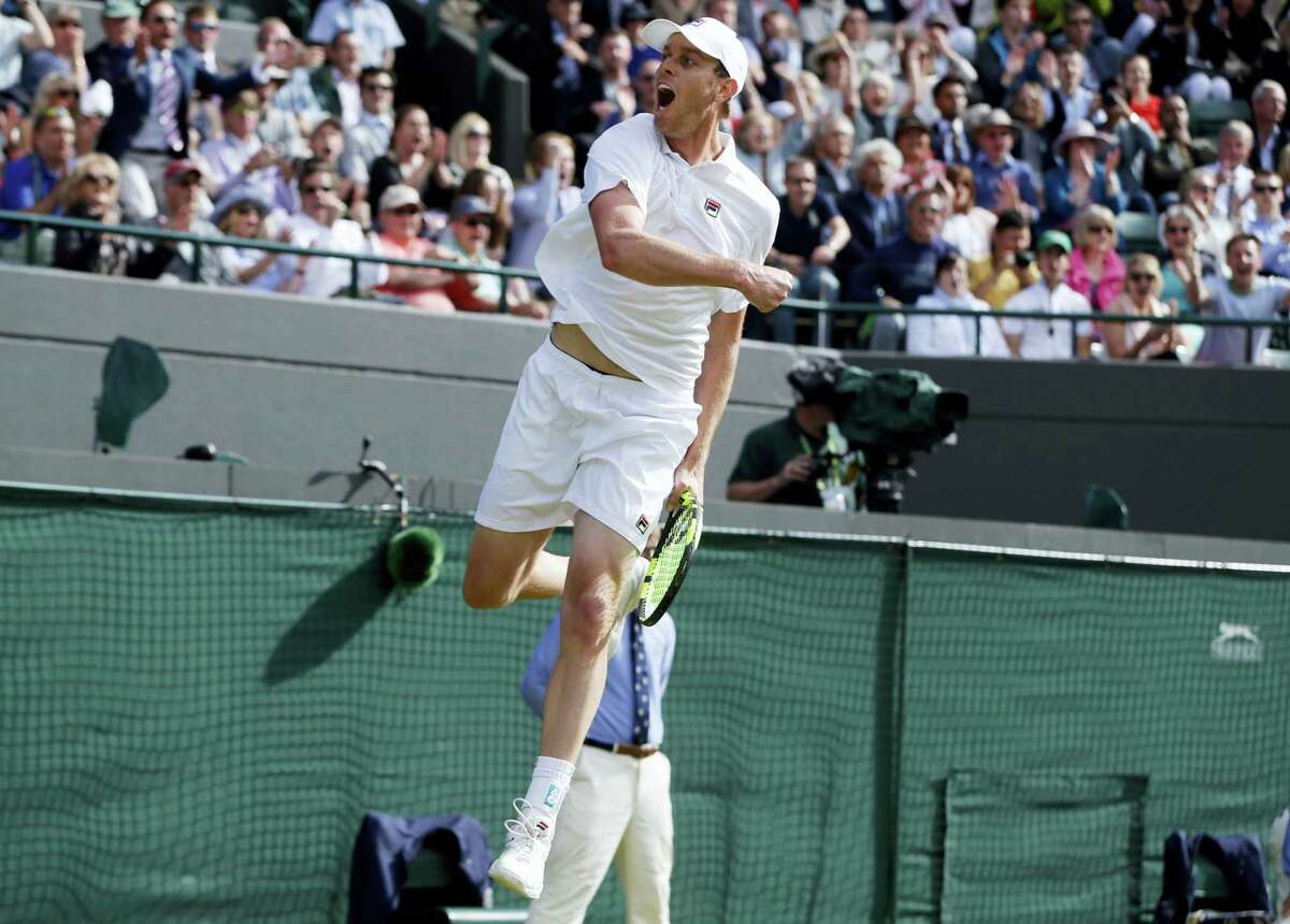 Sam Querrey celebrates after beating Novak Djokovic.