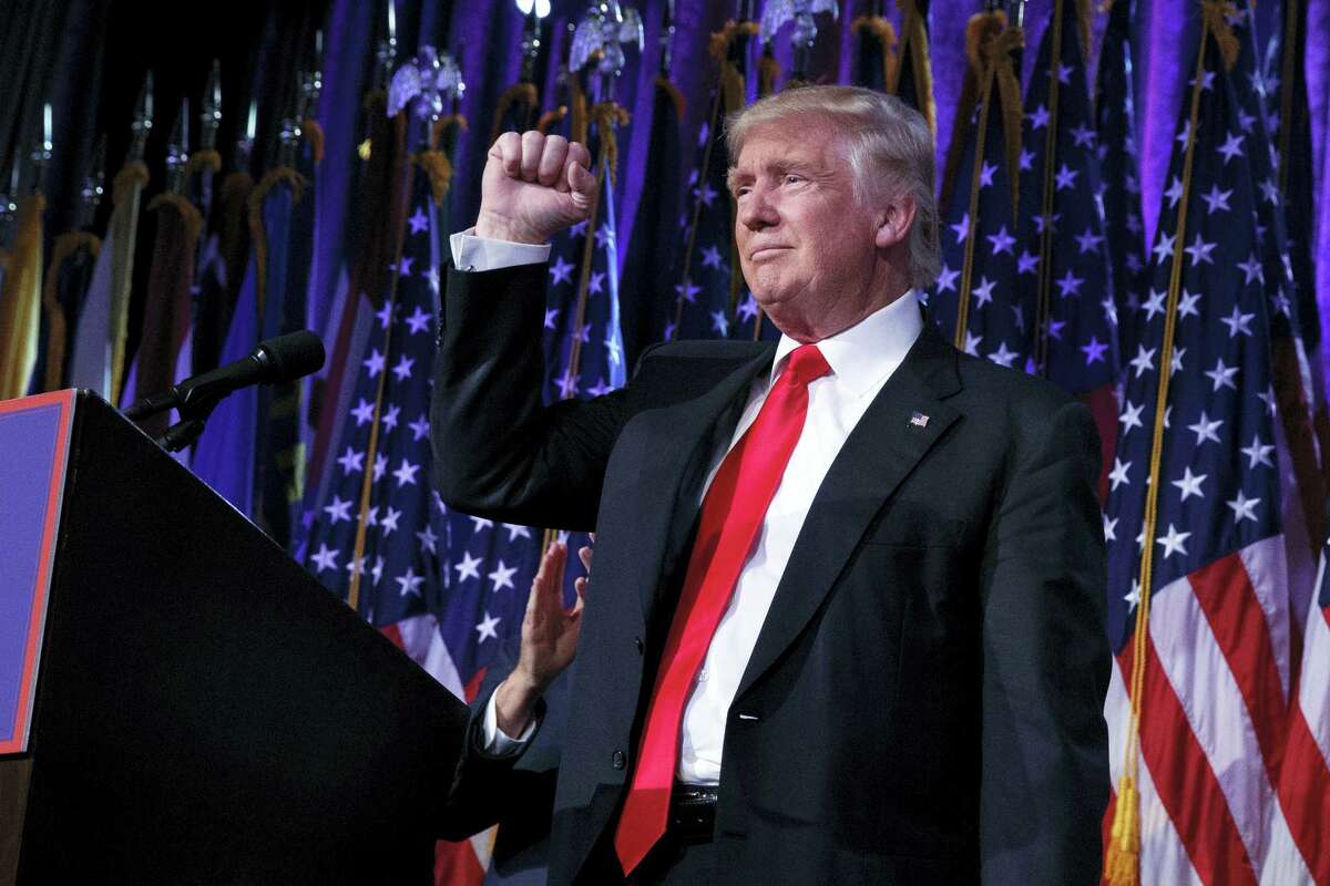 President-elect Donald Trump pumps his fist during an election night rally on Wednesday, Nov. 9, 2016 in New York.