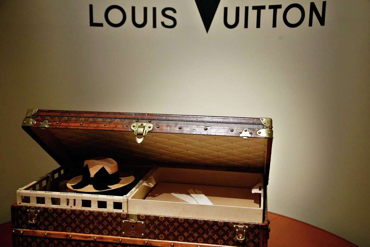 AP Photo/Thibault Camus A 1906 trunk owned by Louis Vuitton is displayed at the Louis Vuitton’s exhibition “Fly, Sail, Travel” at the Grand Palais, in Paris, Thursday, Dec. 3, 2015. Fashion powerhouse Louis Vuitton is showcasing its 160 years of know-how in Paris with a new exhibit that probes deep inside the history of the famed monogram bags.
