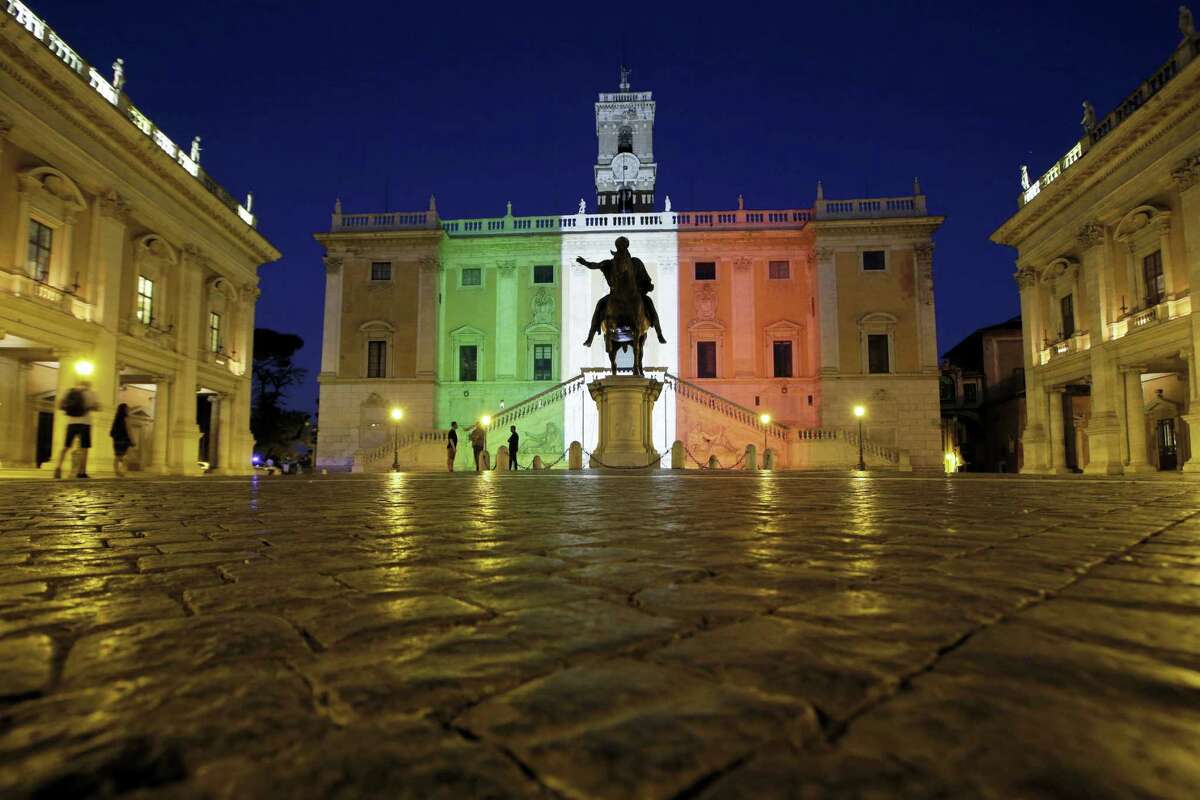 The facade of Rome’s Campidoglio Capitol Hill is lit with the colors of the Italian flag, in Rome, Saturday, July 2, 2016. Italy’s foreign minister said the bodies of nine Italians have been identified after a group of armed extremists stormed a restaurant in Bangladesh.
